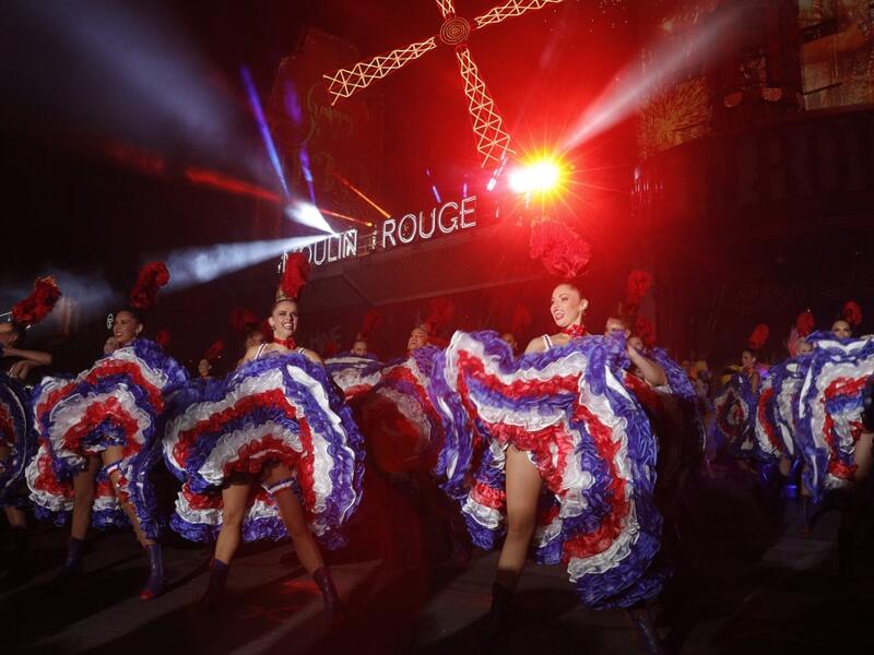 Moulin Rouge dancers perform during the celebration of the 130th anniversary of the French oldest cabaret, on October 6, 2019 in Paris.  GEOFFROY VAN DER HASSELT / AFP
