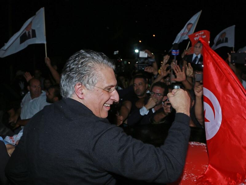 Tunisia's presidential candidate Nabil Karoui greets his supporters after being released from Mornaguia prison near the capital Tunis on October 9, 2019. (AFP/ File Photo)