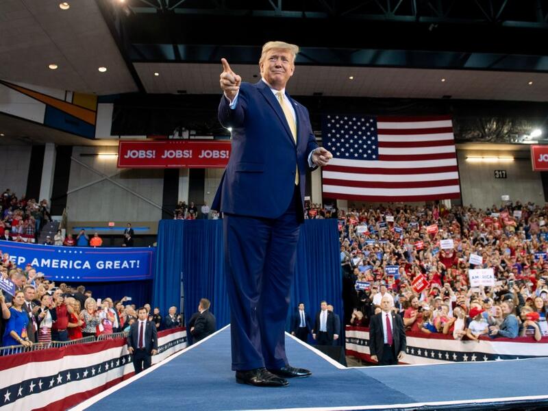 US President Donald Trump gestures as he arrives for a "Keep America Great" rally at Sudduth Coliseum at the Lake Charles Civic Center in Lake Charles, Louisiana, on October 11, 2019. (SAUL LOEB / AFP)