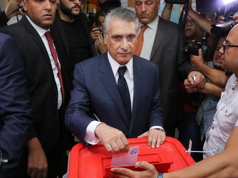 Tunisia's presidential candidate Nabil Karoui casts his ballot at a polling station in the capital Tunis on October 13, 2019 during the second round of the presidential election. Tunisians began voting today in a presidential runoff pitting conservative law professor Kais Saied against media magnate Nabil Karoui, who was released from prison just days earlier. ANIS MILI / AFP