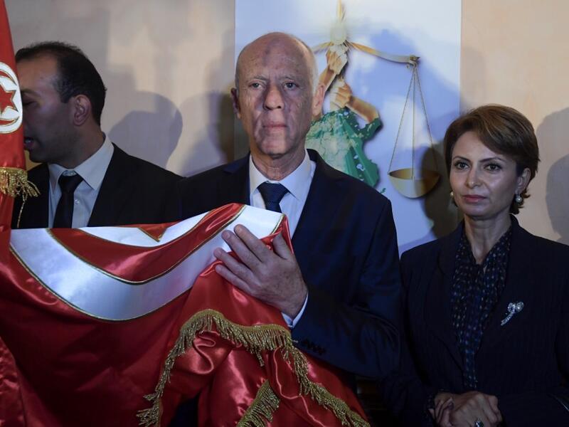 Academic Kais Saied celebrates his victory in the Tunisian presidential election in the capital Tunis on October 13, 2019. Saied won a landslide victory in Tunisia's presidential runoff, sweeping aside his rival, media magnate Nabil Karoui, state television Wataniya said. It said he scooped almost 77 percent of the vote, compared to 23 percent for Karoui. Fethi Belaid / AFP