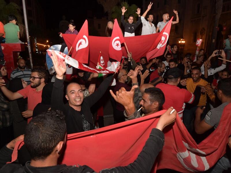 Conservative academic Kais Saied, a political outsider, won a landslide victory Sunday in Tunisia's presidential runoff, sweeping aside his rival, media magnate Nabil Karoui, state television said. Fethi Belaid / AFP