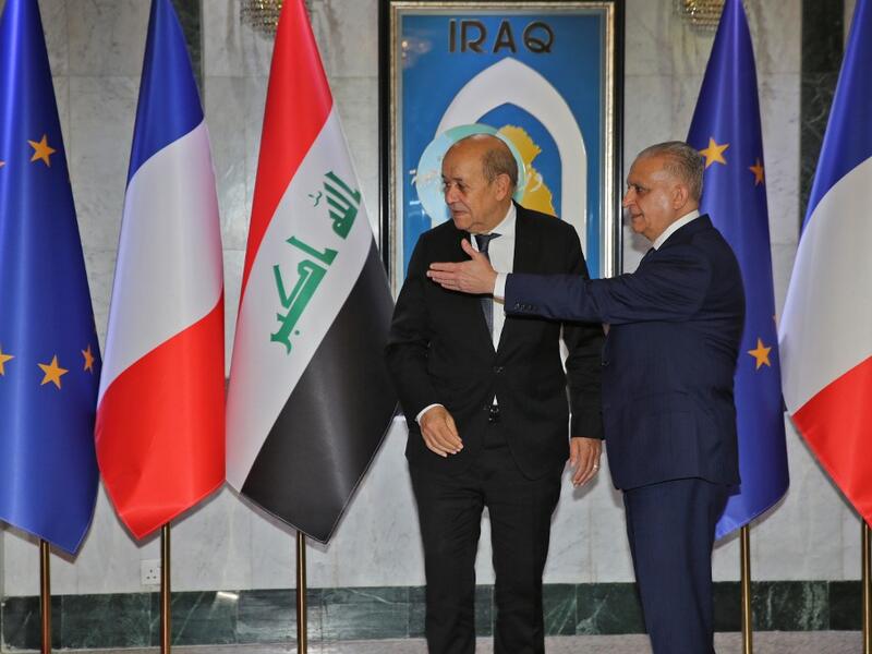Iraqi Foreign Minister Mohammed Ali al-Hakim (R) meets his French counterpart Jean-Yves Le Drian in Baghdad on October 17, 2019. SABAH ARAR / AFP