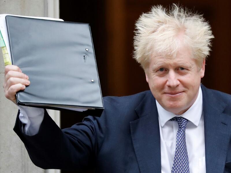 Britain's Prime Minister Boris Johnson reacts as he leaves from 10 Downing Street in central London on October 23, 2019, before heading to the House of Commons for Prime Minister's Questions (PMQS). British Prime Minister Boris Johnson said Tuesday he will pause efforts to pass his Brexit deal, after MPs gave their preliminary approval for it but rejected his timetable to push it through parliament this week. The president of the European Council, Donald Tusk, recommended that EU leaders postpone Britain's departure from the bloc while its prime minister seeks approval of their divorce deal. Tolga AKMEN / AFP Britain's Prime Minister Boris Johnson reacts as he leaves from 10 Downing Street in central London on October 23, 2019, before heading to the House of Commons for Prime Minister's Questions (PMQS). British Prime Minister Boris Johnson said Tuesday he will pause efforts to pass his Brexit deal, after MPs gave their preliminary approval for it but rejected his timetable to push it through parliament this week. The president of the European Council, Donald Tusk, recommended that EU leaders postpone Britain's
