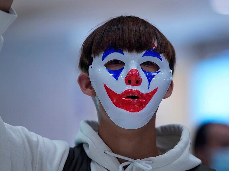 Pro-democracy demonstrators held up their phone lights and chanted slogans calling for a 'revolution of our times' (www.dailymail.co.uk)