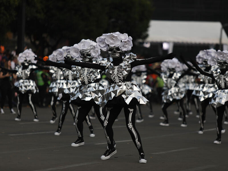 Participants in costume perform during the annual International Day of the Dead Parade in Mexico City  Emilio Espejel / Anadolu Agency / Getty