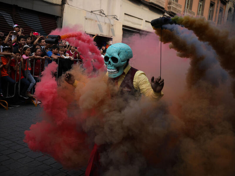 Participants in costume perform during the annual International Day of the Dead Parade in Mexico City  Emilio Espejel / Anadolu Agency / Getty