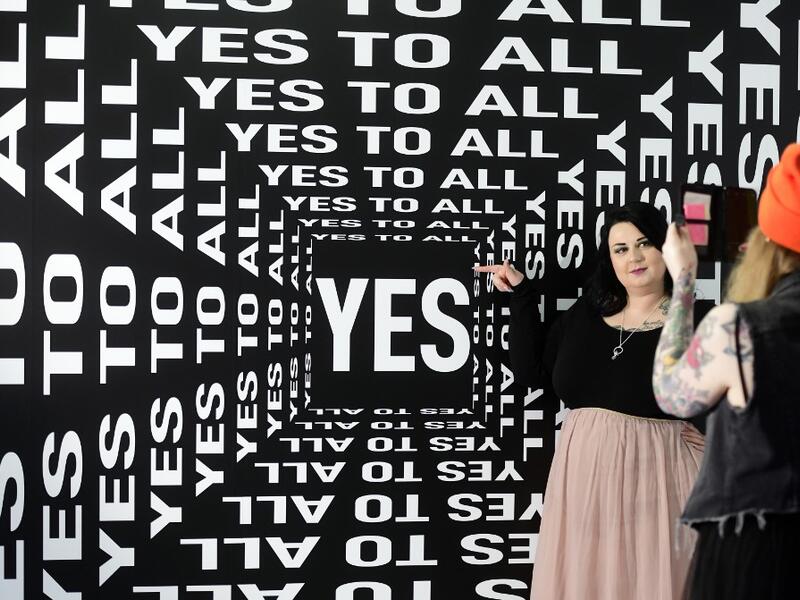 A woman is being photographed at the "Supercandy Pop-Up Museum Vol. 2" in Cologne, western Germany on November 1, 2019. It is an interactive museum and offers a photo backdrop for social media at 25 stations. INA FASSBENDER / AFP