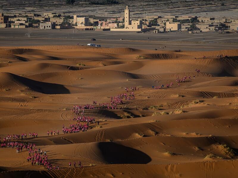 Women take part in the desert trek "Rose Trip Maroc", on November 4, 2019 in the erg Chebbi near Merzouga. The Rose Trip Maroc is a female-oriented trek where teams of three must travel through the southern Moroccan Sahara desert with a compass, a map and a topographical reporter. JEAN-PHILIPPE KSIAZEK / AFP