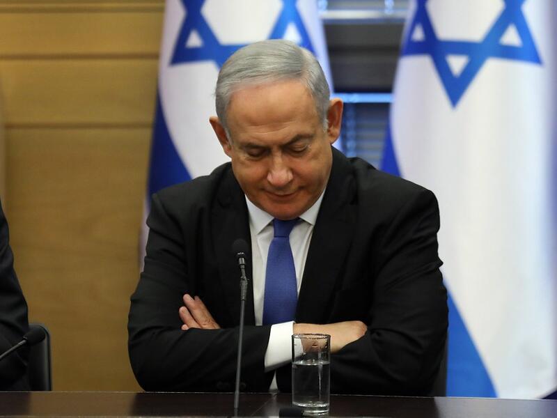 Israeli Prime Minister Benjamin Netanyahu reacts during a meeting of the right-wing bloc at the Knesset (Israeli parliament) in Jerusalem on November 20, 2019. (AFP/ File Photo)