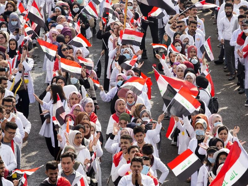 Iraqi engineering students take part in an anti-government demonstration in the southern city of Basra  (AFP)