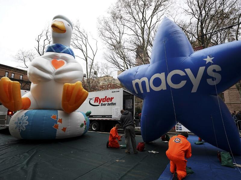 The Aflac Duck and Macys balloon are pictured during the Macy's Thanksgiving Day Parade balloon inflation in New York City on November 27, 2019, offering spectators the chance to see the giant balloons being inflated ahead of tomorrow's Parade. Macy's and NYPD will make a decision tommorow on the fate of the balloons due to high winds in the forecast. TIMOTHY A. CLARY / AFP