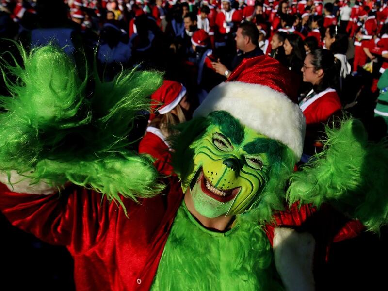 A participant dressed as the Green Goblin in Santa Claus costume participate in the "Run Santa Run Guadalajara" annual Christmas race, in Guadalajara, Mexico, on December 8, 2019. Ulises RUIZ / AFP
