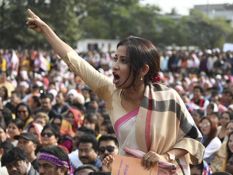 A woman shouts as she takes part in a musical concert along with others to protest against the Indian government's Citizenship Amendment Bill (CAB) in Guwahati on December 15, 2019. Sajjad HUSSAIN / AFP