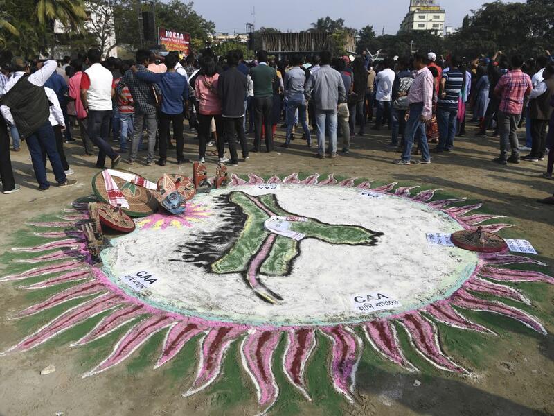 A traditional painting is pictured at a musical concert to protest against the Indian government's Citizenship Amendment Bill (CAB) in Guwahati on December 15, 2019. Some 5,000 people took part in a fresh demonstration in Guwahati on December 15, with hundreds of police watching on as they sang, chanted and carried banners with the words "long live Assam". SAJJAD HUSSAIN / AFP