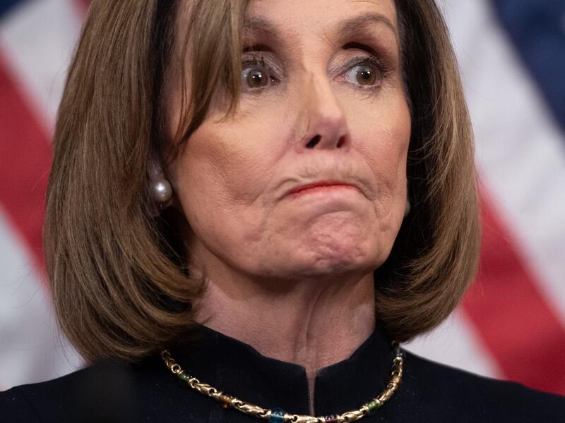 US Speaker of the House Nancy Pelosi holds a press conference after the House passed Resolution 755, Articles of Impeachment Against President Donald J. Trump, at the US Capitol in Washington, DC, on December 18, 2019. The US House of Representatives voted 229-198 on Wednesday to impeach President Donald Trump for obstruction of Congress. The House impeached Trump for abuse of power by a 230-197 vote. The 45th US president is just the third occupant of the White House in US history to be impeached. SAUL LOE