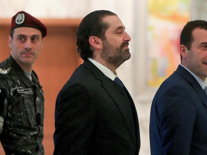 Lebanese caretaker Prime Minister Saad Hariri walks at the presidential palace in Baabda, east of Beirut, on December 19, 2019. AFP