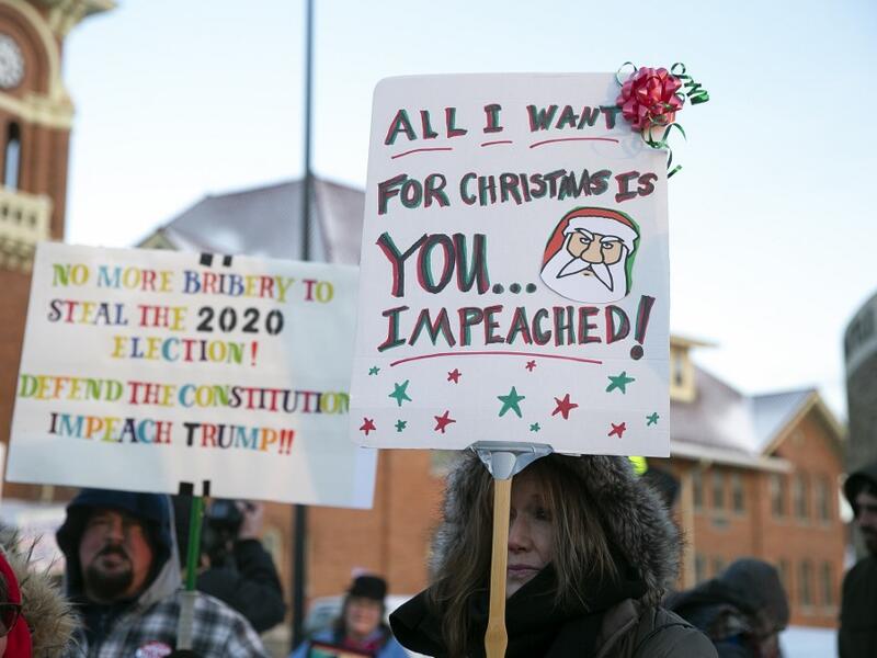 Anti-Trump protesters gather outside at Monument Park on December 18, 2019 in Battle Creek, Michigan. The full House of Representatives is voting on two articles of impeachment against President Donald Trump. Nuccio DiNuzzo/Getty Images/AFP