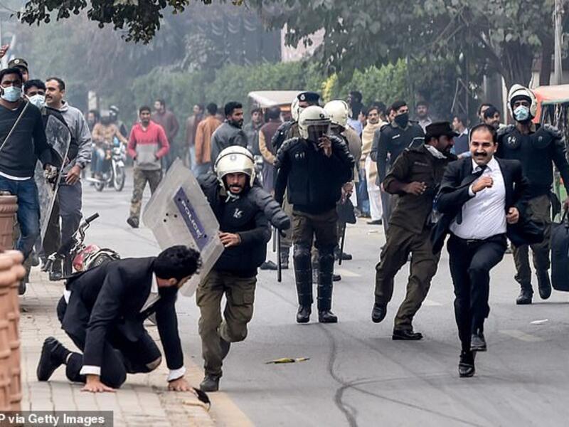 Policemen chase lawyers following a clash between lawyers and doctors in Lahore today (AFP/ File Photo) Policemen chase lawyers following a clash between lawyers and doctors in Lahore today (AFP/ File Photo)