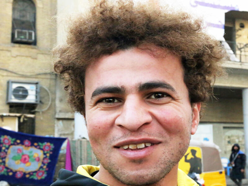 An Iraqi anti-government protestor poses with a distinct hairstyle at Tahrir Square in central Baghdad on December 23, 2019. Since the start of Iraq's anti-government protests on October 1, one thing strikes the eye perhaps above all else -- the unbridled hairstyles young men sport. High quiffs, tight fades and loads of attitude -- it is quite the male beauty pageant. SABAH ARAR / AFP