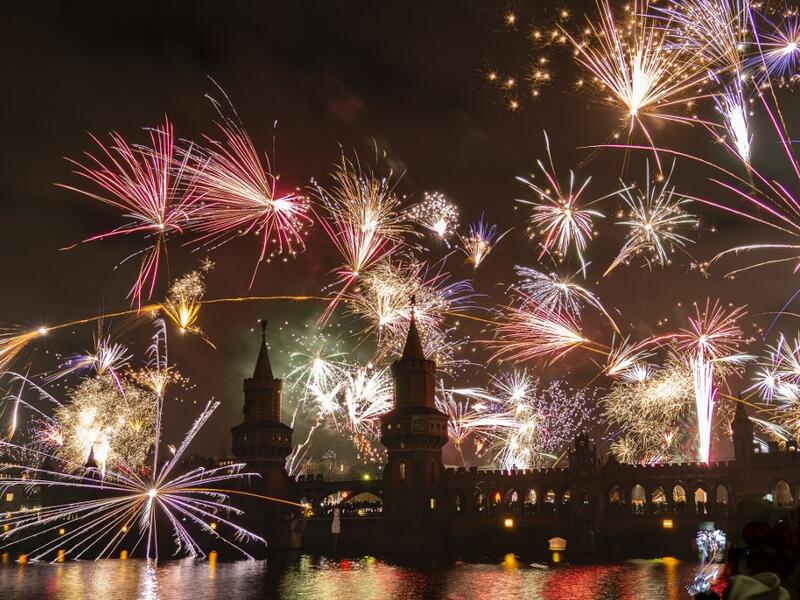 Fireworks explode over the river Spree and the Oberbaumbrücke bridge in Berlin, Germany, on January 1, 2020, to welcome the new year. Paul Zinken / dpa / AFP