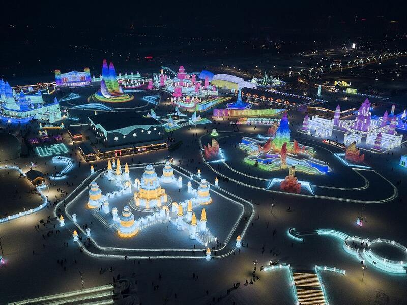 An aerial view shows ice sculptures illuminated ahead of the opening of the Harbin International Ice and Snow Festival in Harbin, in China's northeast Heilongjiang province on January 3, 2020. NOEL CELIS / AFP