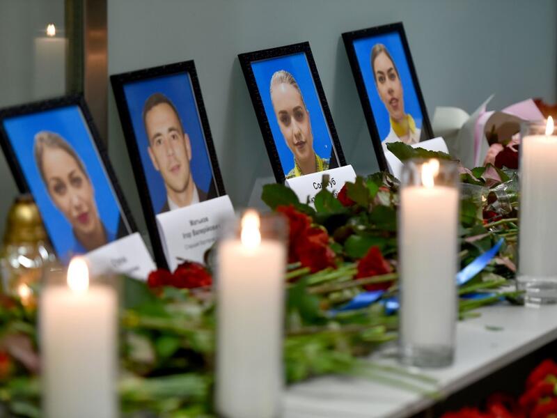 Portraits of the victims of the Ukraine International Airlines Boeing 737-800 crash in the Iranian capital Tehran, are seen at a memorial at the Boryspil airport outside Kiev on January 8, 2020. A Ukrainian airliner crashed shortly after take-off from Tehran Wednesday killing all 176 people on board, in a disaster striking a region rattled by heightened military tensions. Sergei SUPINSKY / AFP