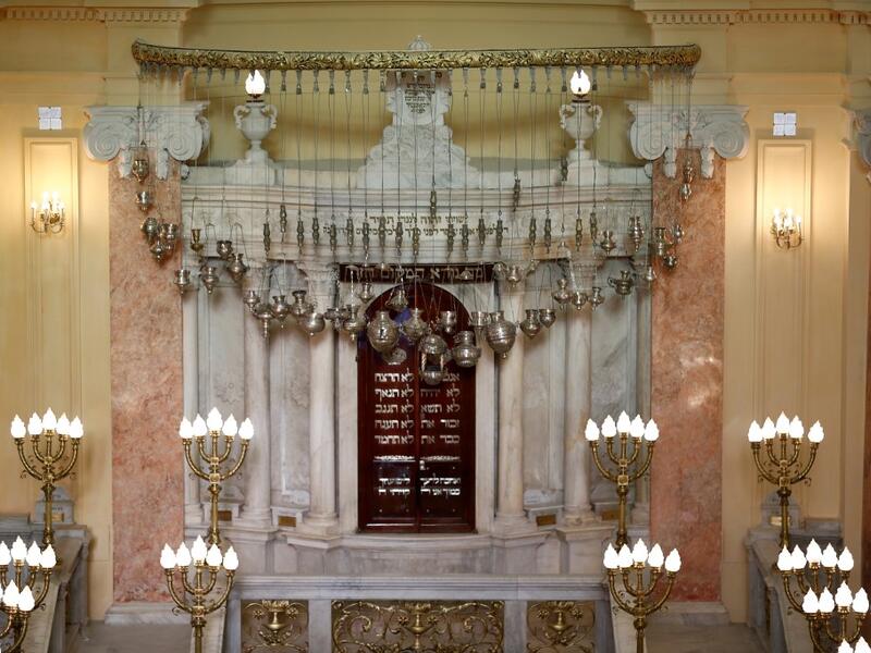The synagogue, boasting green and violet stained glass windows and towering marble columns, was built in its current form in 1850 by an Italian architect on top of the original edifice dating back to 1354. Khaled DESOUKI / AFP