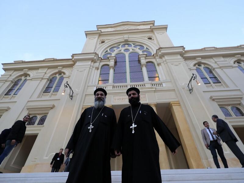 Coptic priests leave after visiting the newly renovated Eliyahu Hanavi synagogue in the northwestern Egyptian city of Alexandria on January 10, 2020, on the day of its inauguration. The synagogue, boasting green and violet stained glass windows and towering marble columns, was built in its current form in 1850 by an Italian architect on top of the original edifice dating back to 1354. Khaled DESOUKI / AFP