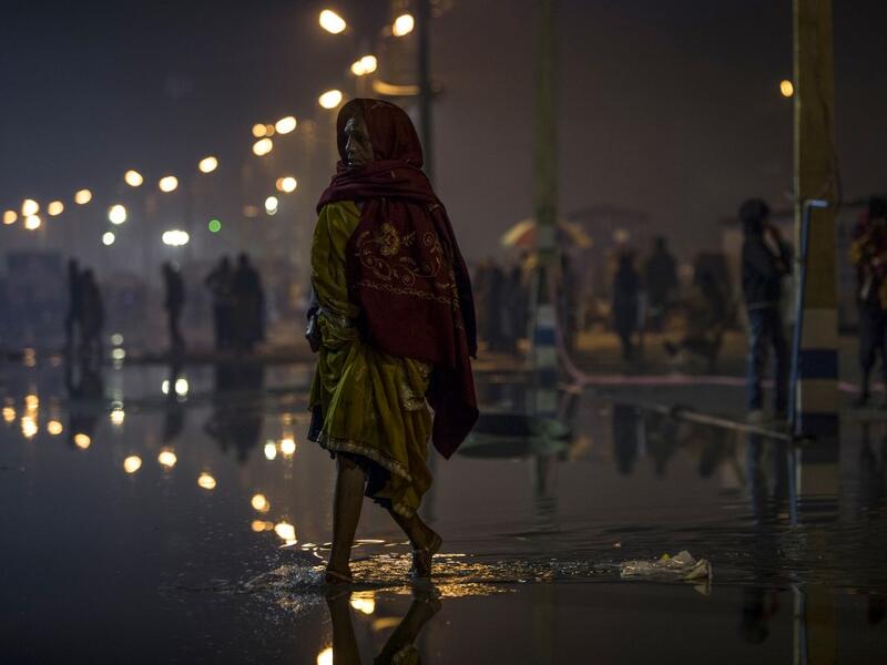 A Hindu devotee walks towards the festival area during the Gangasagar Mela, at Sagar Island, some 150 kilometres south of Kolkata on January 14, 2020. XAVIER GALIANA / AFP