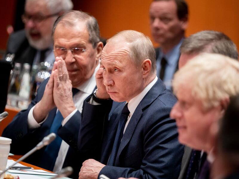 Acting Russian Foreign Minister Sergei Lavrov (L)sits next to Russian President Vladimir Putin at the start of a Peace summit on Libya at the Chancellery in Berlin, on January 19, 2020. World leaders gather in Berlin on January 19, 2020 to make a fresh push for peace in Libya, in a desperate bid to stop the conflict-wracked nation from turning into a "second Syria". AFP
