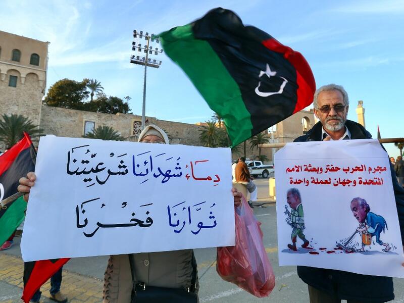 Libyans take part in a demonstration against eastern strongman Khalifa Haftar, and in support of the UN-recognised government of national accord (GNA), in the Martyrs' Square in the GNA-held capital Tripoli on January 24, 2020. AFP