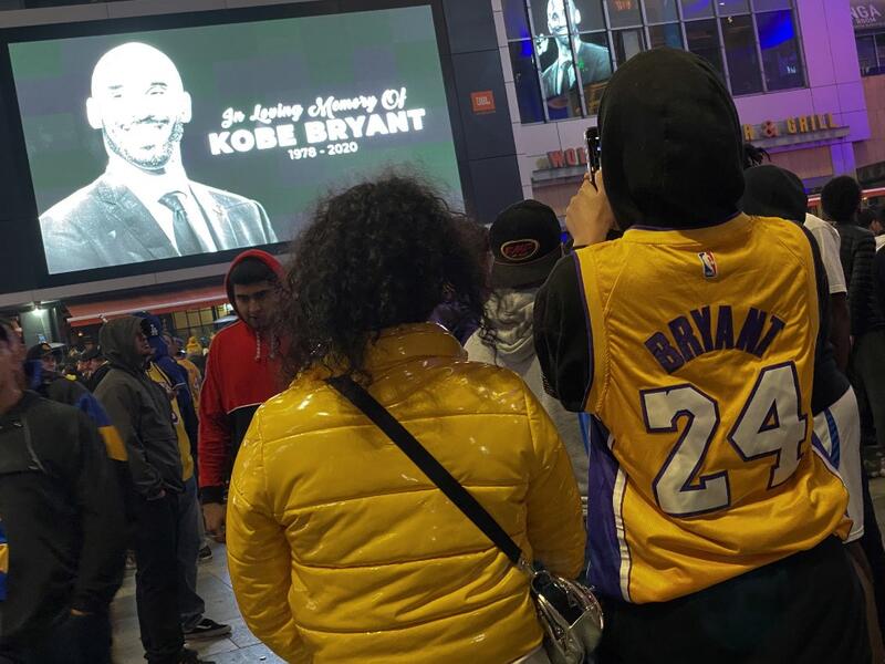 People gather by the Staples Center in Los Angeles on January 26, 2020 as they pay tribute to former NBA and Los Angeles Lakers player Kobe Bryant following his death in a helicopter crash near Los Angeles. (AFP/ File Photo)