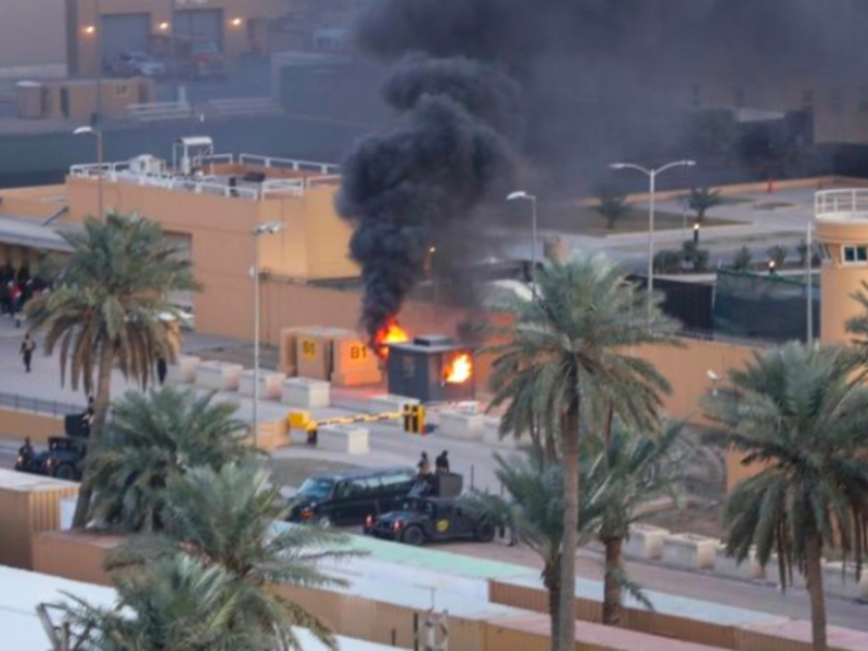 A sentry box burns at an entrance to the United States embassy in the Iraqi capital Baghdad (AFP File Photo)