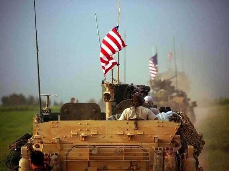 US flag still seen, despite Syria pull-out order (AFP/file photo)