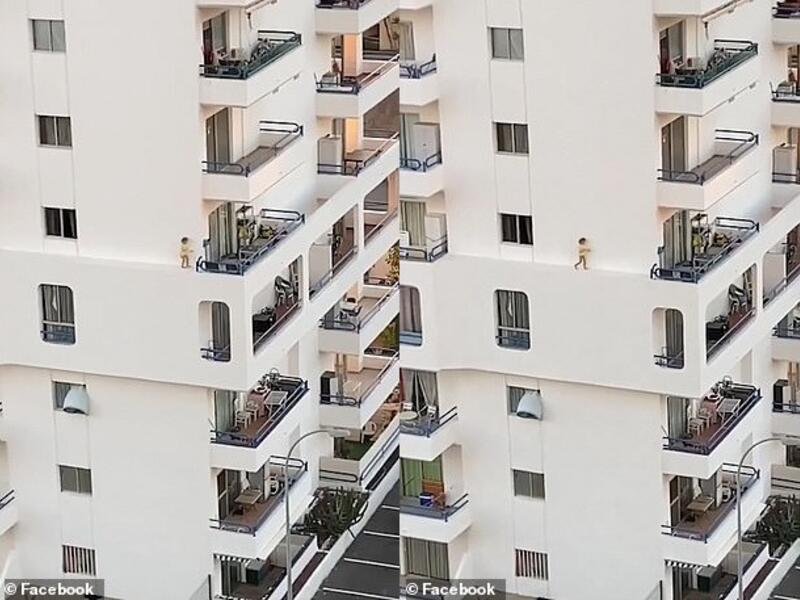 The child jumps as she appears to lose her footing (pictured) and races back along the ridge, before stopping at the window where the footage ends. (Facebook)