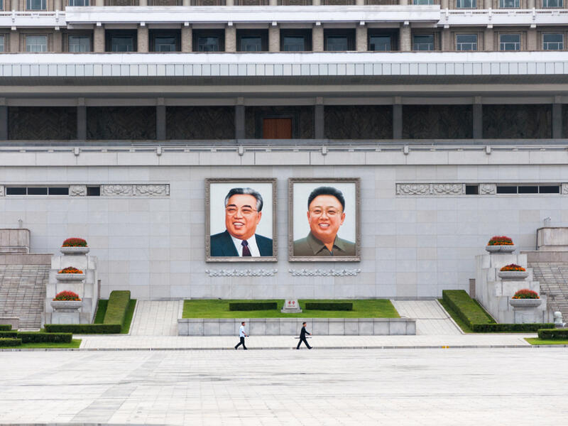 City Square with The Grand People's Study House with portraits of korean leaders Kim Il Sung and Kim Jong Il (Shutterstock)	