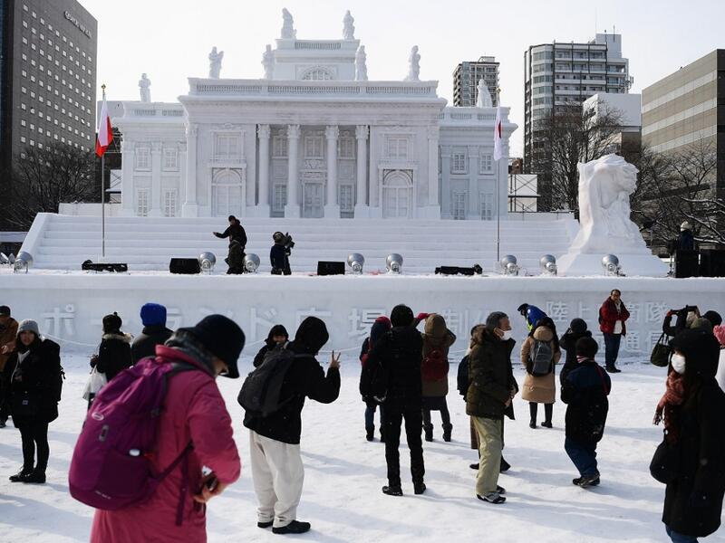 Organisers for this year's festival were forced to truck in an unprecedented amount of extra powder to build their signature sculptures after an unseasonably warm winter.  CHARLY TRIBALLEAU / AFP
