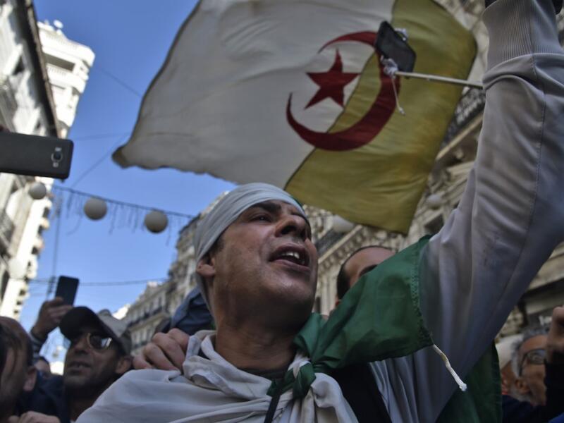 Algerians chant slogans as they march in an anti-government demonstration in the capital Algiers on February 14, 2020. RYAD KRAMDI / AFP