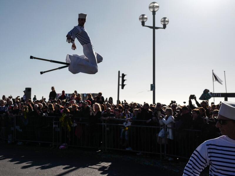 Participants in fancy dress take part in the 136th Nice Carnival parade which celebrates this year the 'Fashion King' in Nice, southeastern France, on February 15, 2020. The carnival runs from February 15 to February 29, 2020. VALERY HACHE / AFP