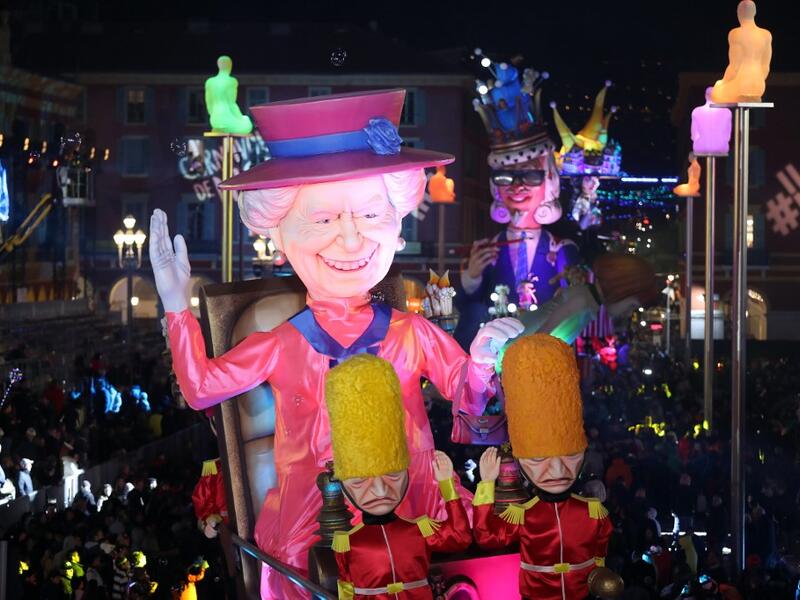 A giant figure depicting Queen Elizabeth II is seen during the 136th Nice Carnival parade in Nice, southeastern France, on February 15, 2020. The Carnival takes place until February 29, 2020 on the theme 'King of Fashion'. VALERY HACHE / AFP