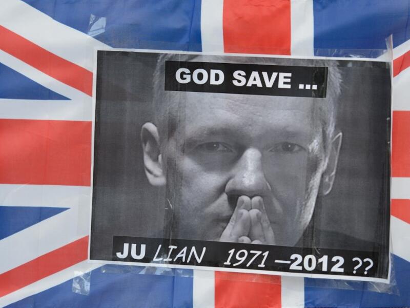 In this file photo taken on May 30, 2012 a portrait of Wikileaks founder Julian Assange is seen taped to a Union Flag outside the Supreme Court in central London, ahead of the verdict on Assange's bid to avoid extradition to Sweden. Later, Britain's Supreme Court ruled that Assange can be extradited to Sweden over alleged sex crimes, as it rejected his appeal. Jailed WikiLeaks founder Julian Assange is facing extradition to the United States over the 2010 publication of thousands of leaked classified docume