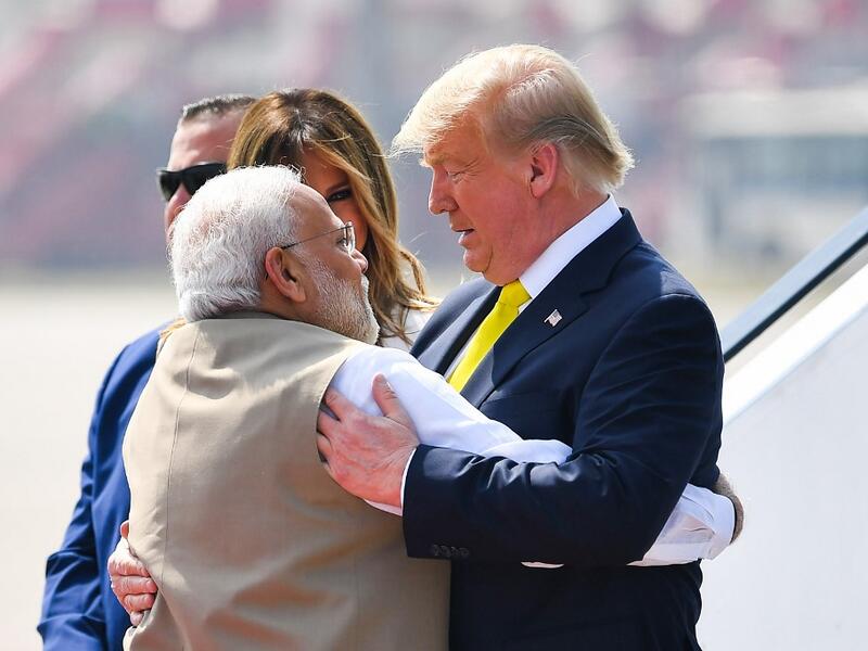 India's Prime Minister Narendra Modi (L) embraces US President Donald Trump upon his arrival at Sardar Vallabhbhai Patel International Airport in Ahmedabad on February 24, 2020. MANDEL NGAN / AFP