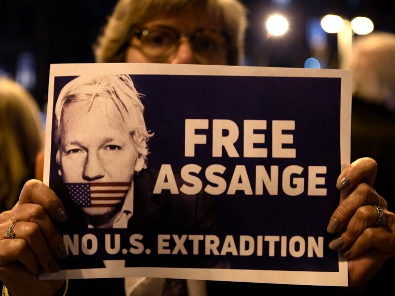 A demonstrator holds a sign during a protest called by Catalan National Assembly (ANC) under the motto "Journalism is not a crime" to support WikiLeaks founder Julian Assange in Barcelona on February 24, 2020. A British court today starts hearing Washington's extradition request for WikiLeaks founder Julian Assange in a test case of media freedoms in the digital age and the global limits of US justice. LLUIS GENE / AFP