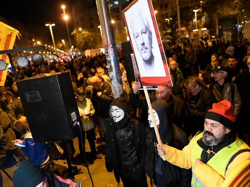 Demonstrators take part in a protest called by Catalan National Assembly (ANC) under the motto "Journalism is not a crime" to support WikiLeaks founder Julian Assange in Barcelona on February 24, 2020. A British court today starts hearing Washington's extradition request for WikiLeaks founder Julian Assange in a test case of media freedoms in the digital age and the global limits of US justice. LLUIS GENE / AFP