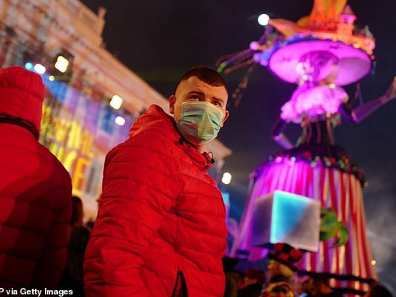 Revellers wear masks to protect themselves from COVID-19 as they attend the Nice carnival in the french riviera city. AFP/File