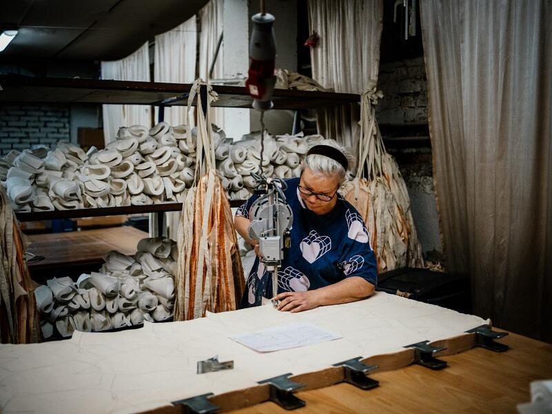 An employees of Grishko company produces pointe shoes in the company's Moscow workshop on February 25, 2020. Born in the chaos of the collapse of the Soviet Union, the Grishko family business has emerged among the top makers in the world of dance shoes, notably classic ballet pointe shoes, worn on the world's great stages. Dimitar DILKOFF / AFP