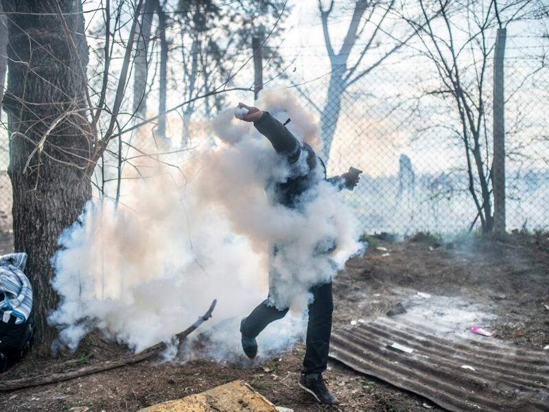 Greek police fired tear gas at migrants who have amassed at a border crossing in the western Turkish province of Edirne, some of whom responded by hurling stones at the officers. The clashes come as Greece bolsters its border after Ankara said it would no longer prevent refugees from crossing into Europe following the death of 33 Turkish troops in northern Syria. BULENT KILIC / AFP