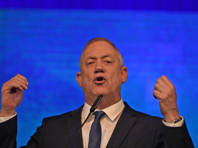 Benny Gantz, leader of the Blue and White (Kahol Lavan) electoral alliance, addresses supporters at their headquarters in the coastal city of Tel Aviv early on March 3, 2020, after polls officially closed. GALI TIBBON / AFP