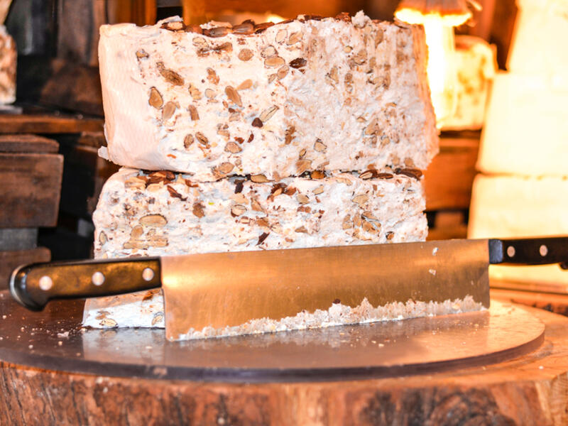 Home made artisan assorted nougat in different flavors. Delicious traditional festive torrone o nougat with nuts, pistachios or almonds (Shutterstock)